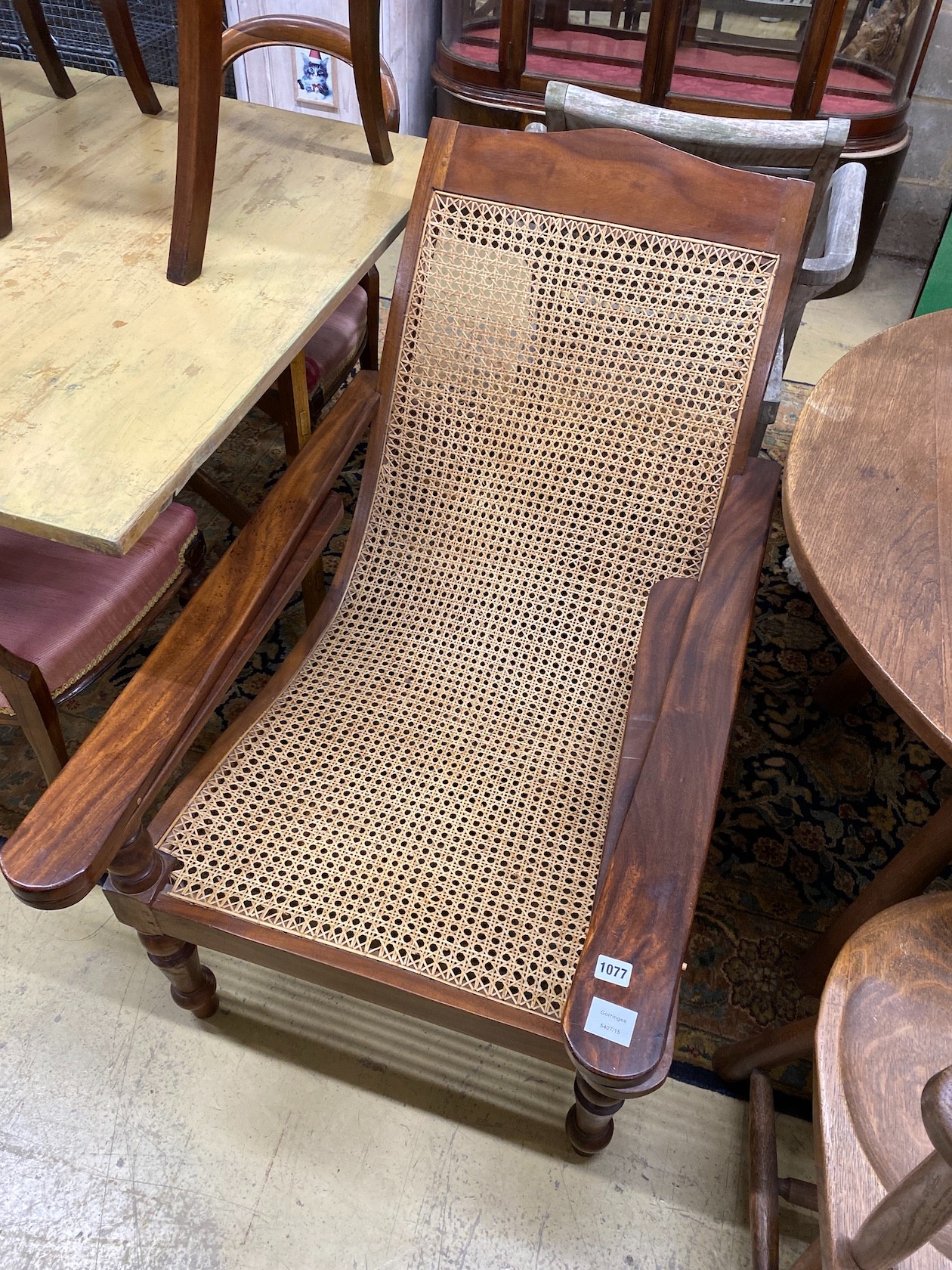 A caned hardwood plantation chair, width 66cm, depth 100cm, height 90cm